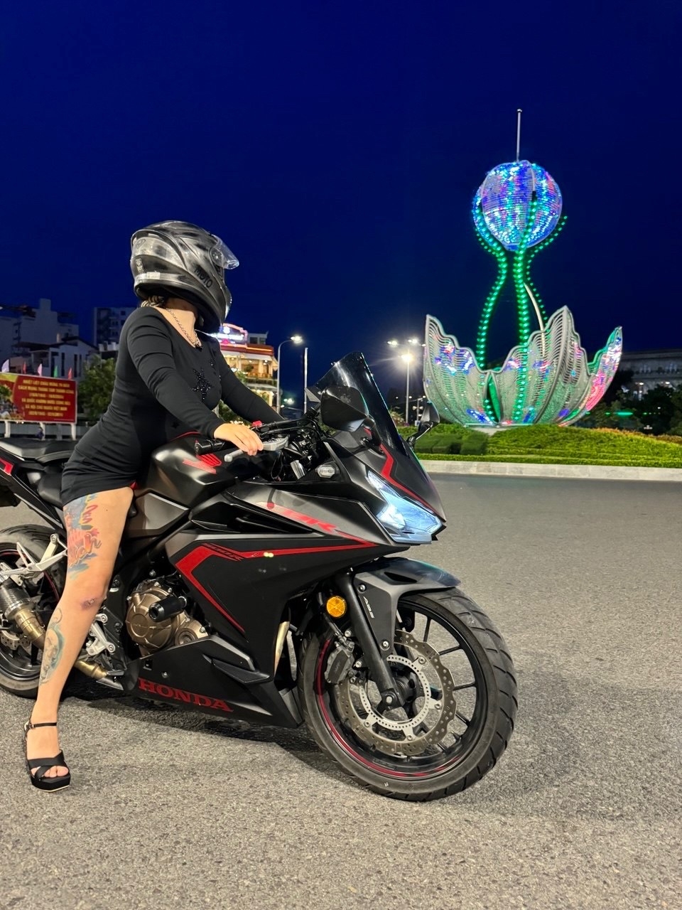 Maria Dyukova (Mariangel777) riding a motorcycle at night