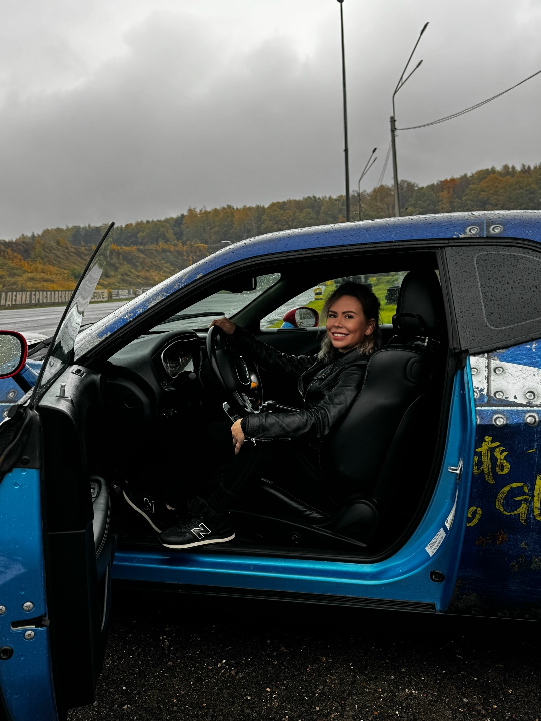 Maria Dyukova (Mariangel777) sitting in a sports car